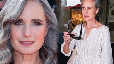 Andie MacDowell struts the streets in a chic casual dress, with her gorgeous silvery hair framing her makeup-free face